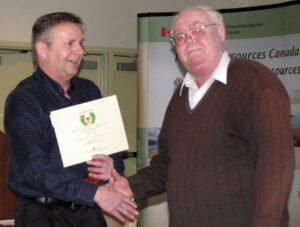 Chris presents Tom's Acorn Award